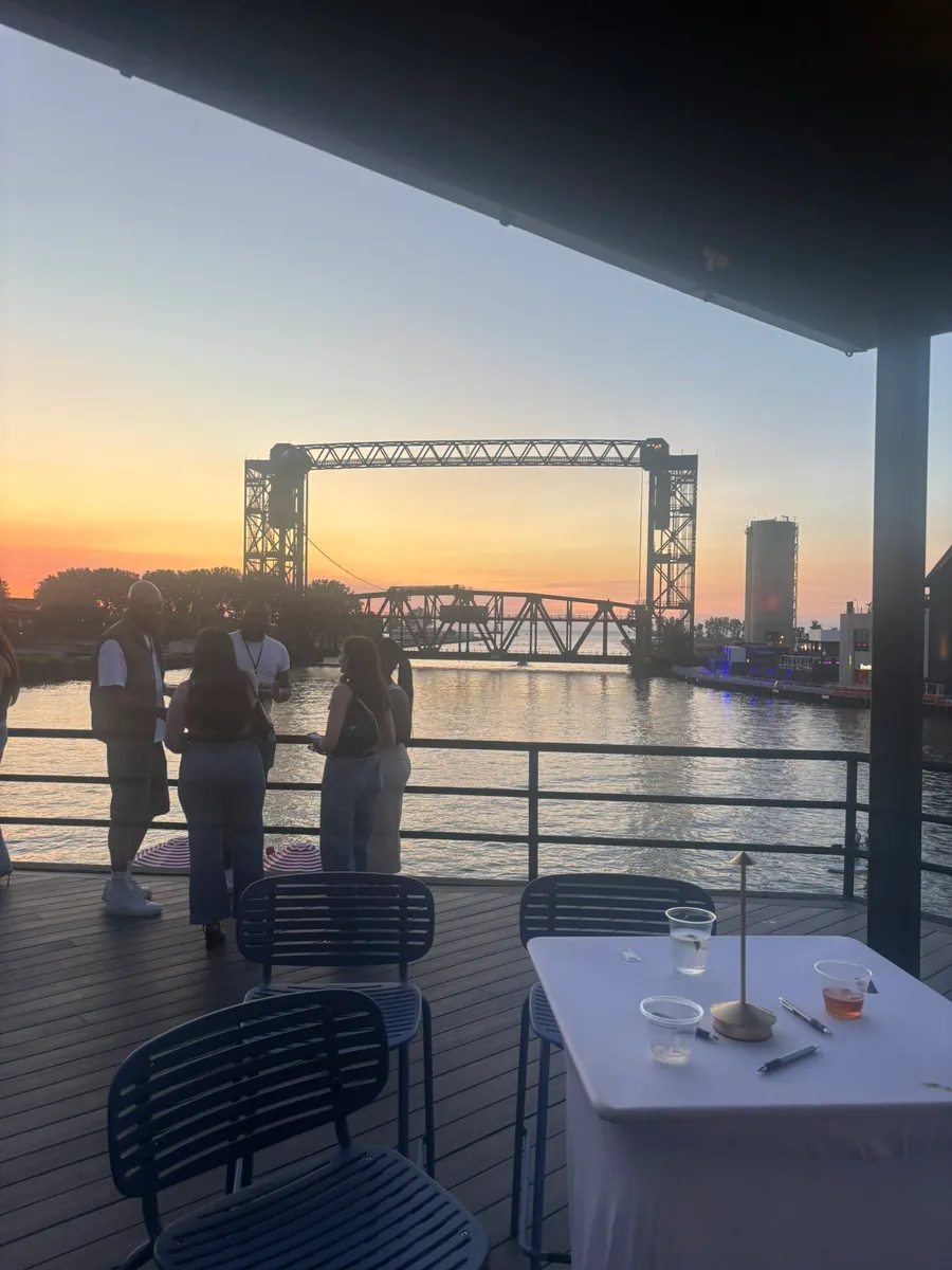 The Cleveland lift bridge over the river at sunset, seen from a patio